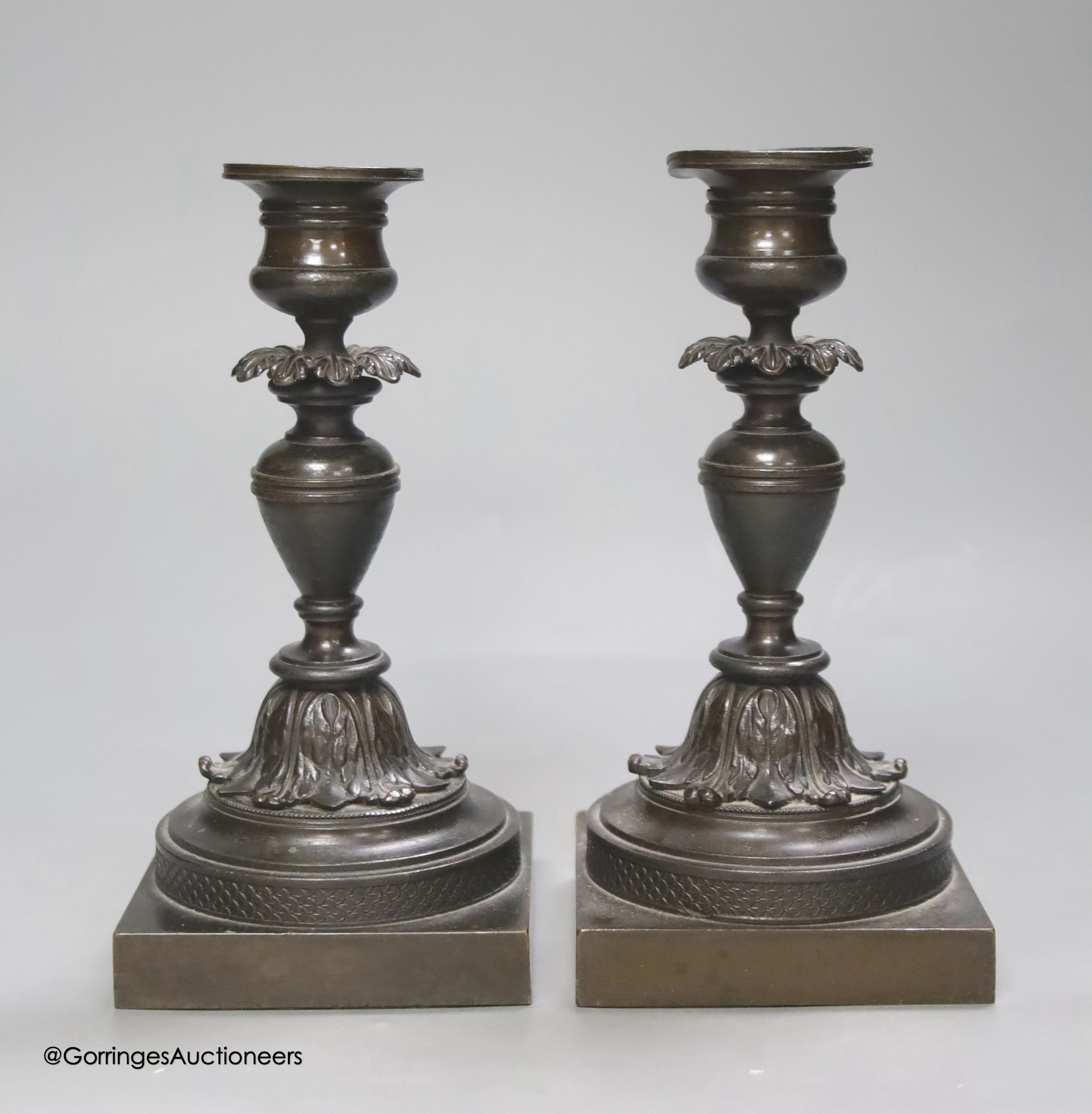 A pair of 19th century French bronze dwarf candlesticks, height 17cm